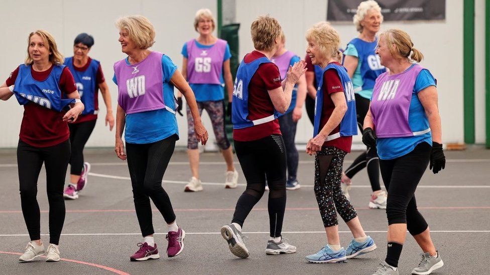 A group of women playing walking netball