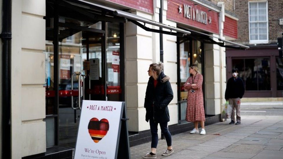 Customers follow social distancing outside a Pret