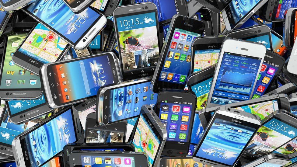 a pile of smartphones
