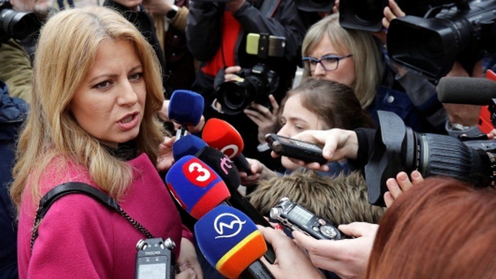 Slovakia presidential candidate Zuzana Caputova speaks to media as she arrives to cast her vote during the country's presidential elections at a polling station in Pezinok, Slovakia, March 16, 2019