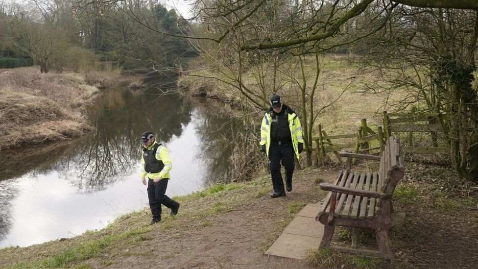 Police activity near the bench by the River Wyre in St Michael's on Wyre, Lancashire, where the mobile phone was found