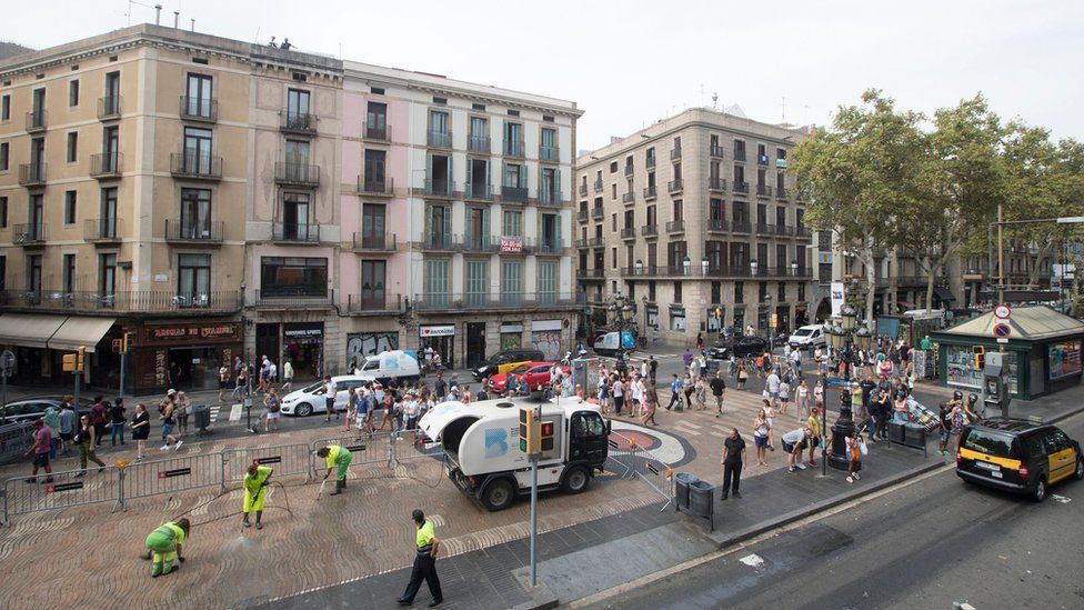 Cleaners restoring Las Ramblas to normal after removing the memorials, Barcelona, 9 August 2017