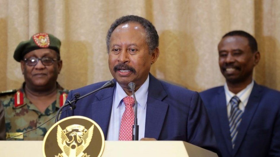 Abdalla Hamdok addresses the media following his swearing in at the presidential palace in Khartoum, Sudan, 21 August 2019