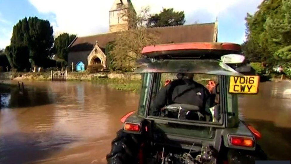 Tractor in floodwater