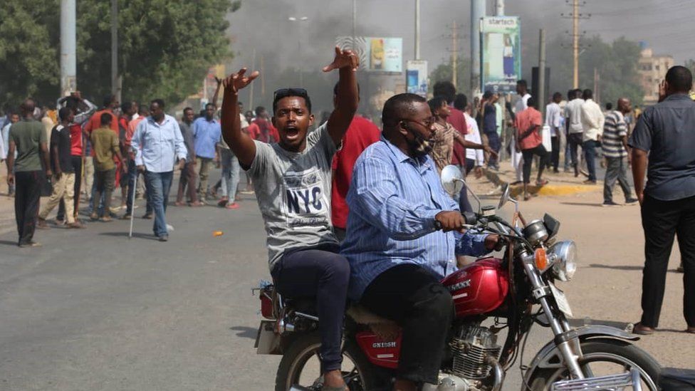 People protest near the army HQ in Khartoum