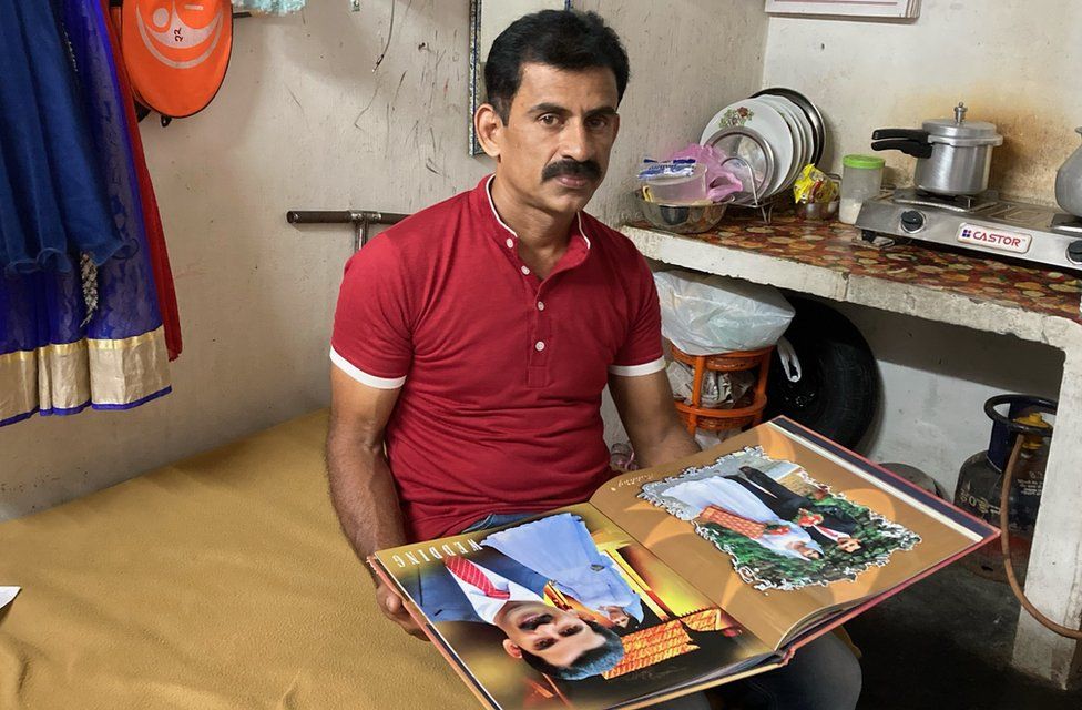 Tomy Thomas with his wedding album