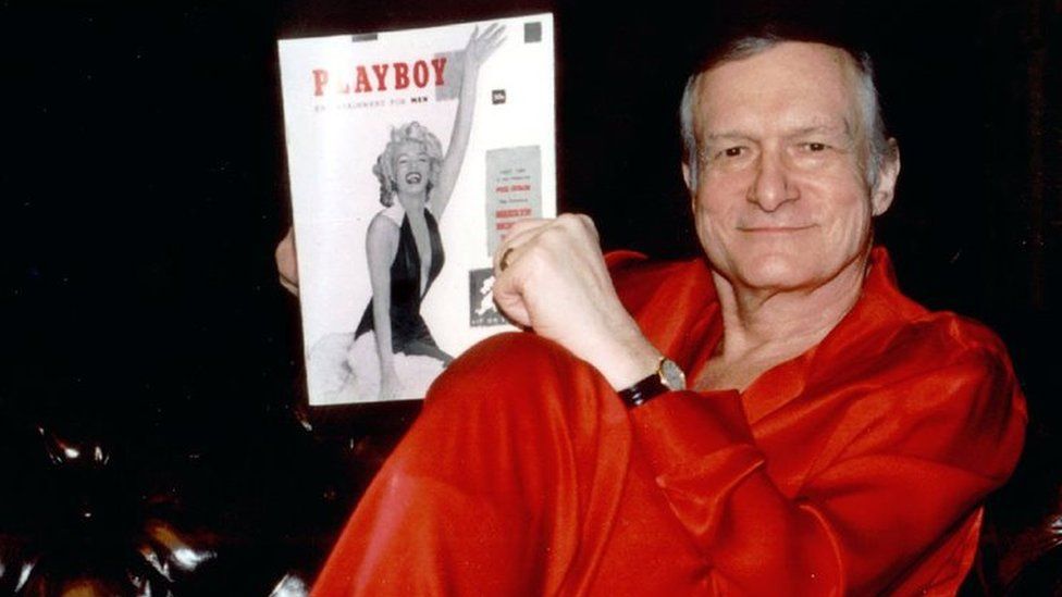 Hugh Hefner with a copy of Playboy magazine. File photo