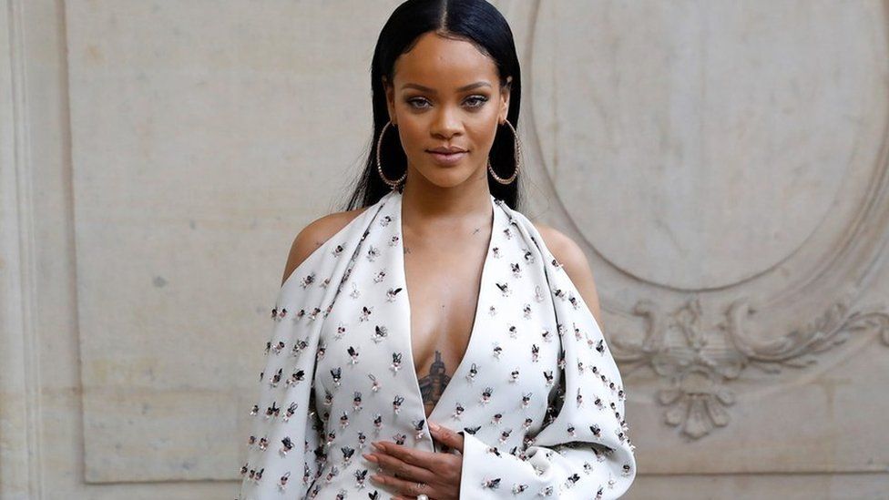 Barbadian singer Rihanna poses before the Christian Dior 2017 Spring/Summer ready-to-wear collection fashion show, on September 30, 2016 in Paris