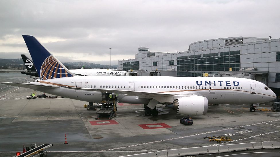 A United Airlines plane sits on the tarmac at San Francisco International Airport - 10 June 2015