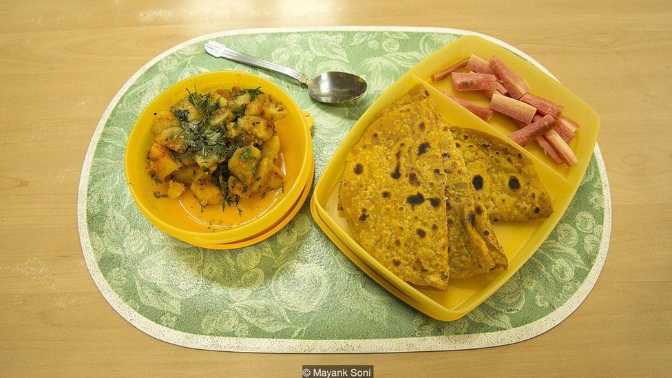 Carrot salad, masala roti and suka bhaji potatoes