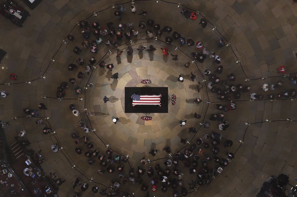 Members of the public pay their respects in the Capitol Rotunda