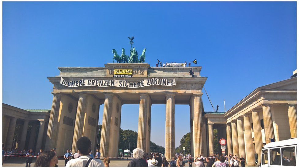Anti-Islam activists have staged an hour-long demonstration atop Berlin’s Brandenburg Gate Saturday 27 August 2016.