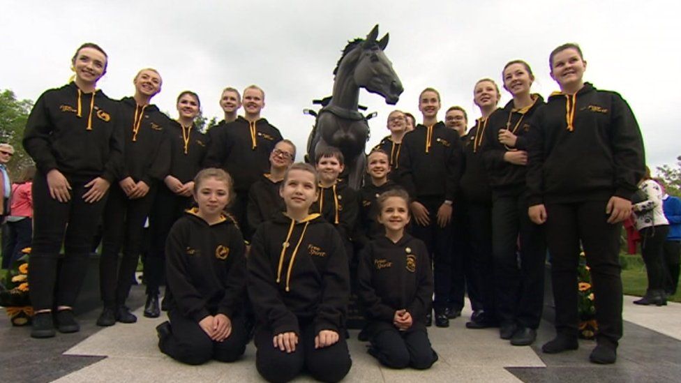 Free Spirit statue with young ambassadors