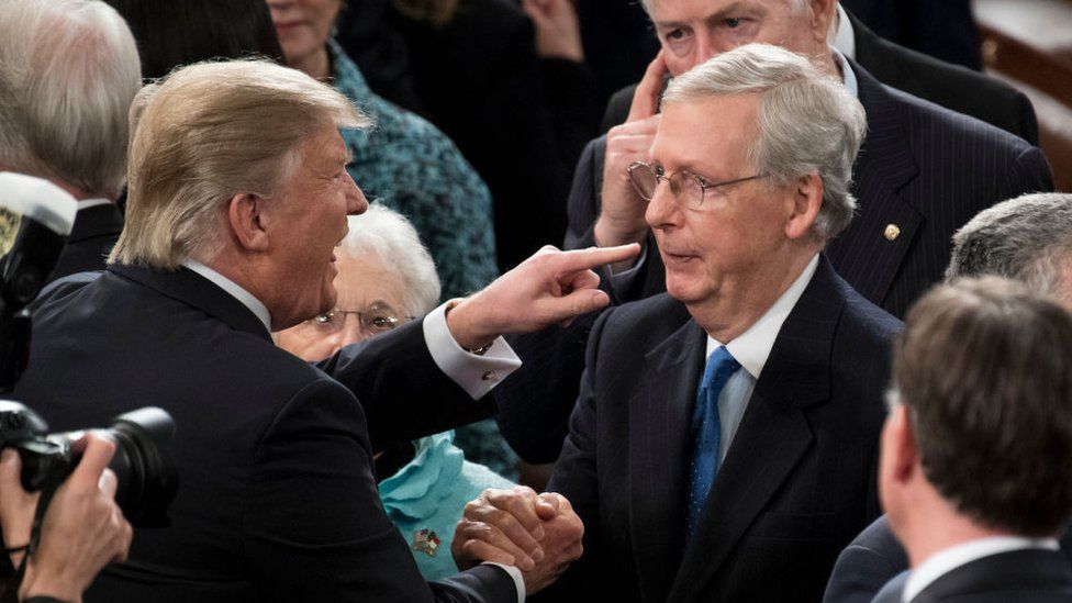 Donald Trump speaks with Mitch McConnell in 2017