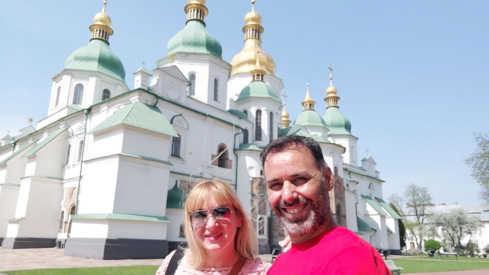 Flavia and José in front of a church in Kyiv