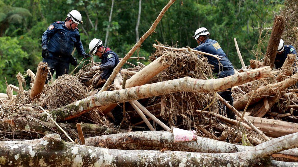 Firefighters work in the search, rescue and recovery operations caused by the overflow of three rivers, in Mocoa, the capital of the Putumayo region, Colombia