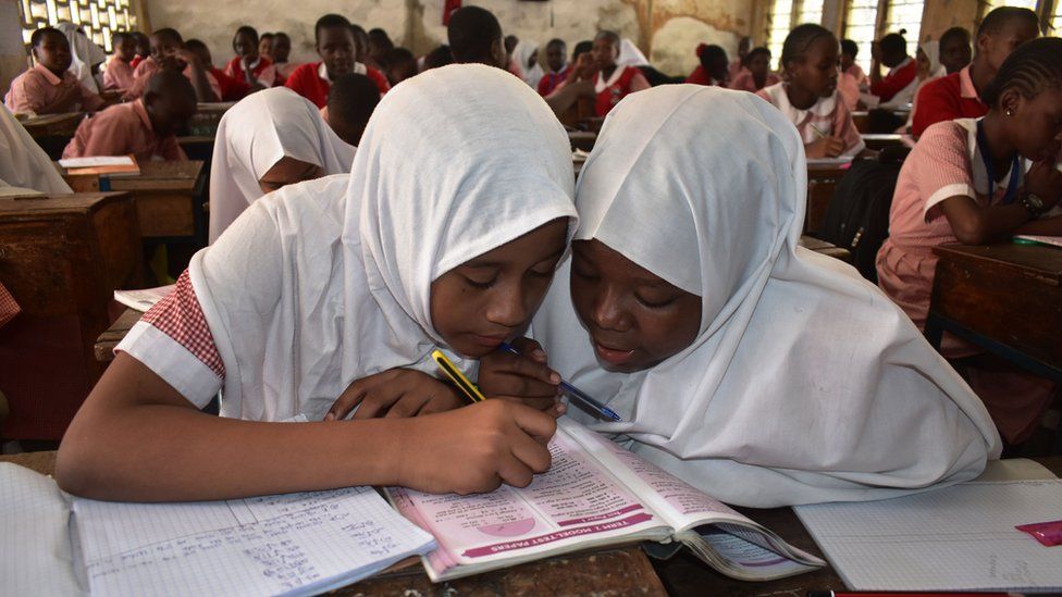 Muslim schoolgirls in hijabs at a class in Mombasa, Kenya
