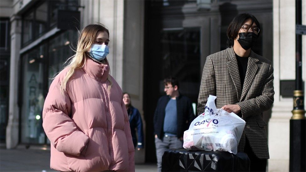 People wear protective face masks