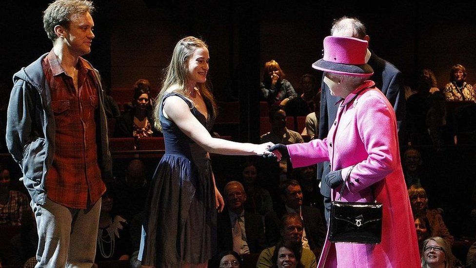 The Queen speaking to Romeo and Juliet actors Sam Troughton (left) and Mariah Gale during a visit to the Royal Shakespeare Theatre in 2011