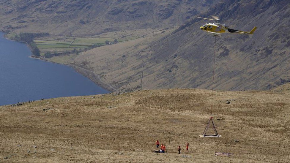 Helicopter used to winch equipment onto Scafell Pike