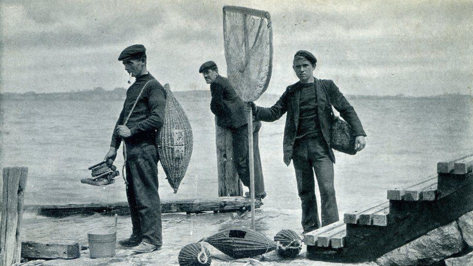 Vintage postcard Guernsey men fishing