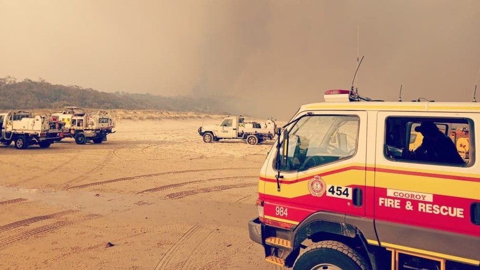 Fire trucks on the beaches at Fraser Island during the major bushfires in December 2020