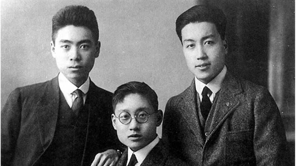 Zhou, Li and a third man, during their time in the UK