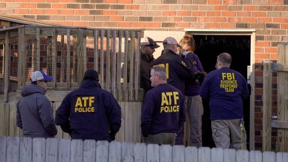 Law enforcement officers search the property of a possible person of interest in Antioch, near Nashville. Photo: 26 December 2020