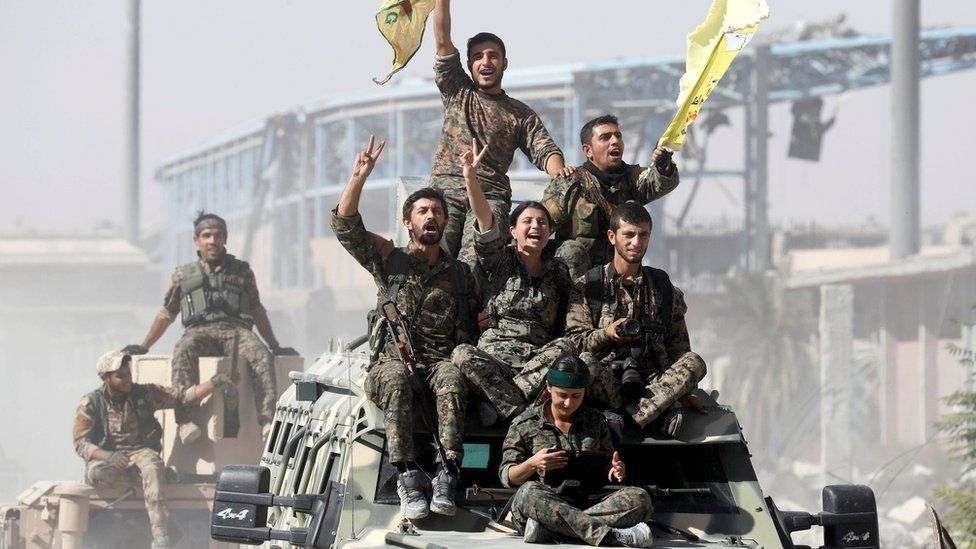 Syrian Democratic Forces fighters celebrate victory in Raqqa, Syria (17 October 2017)