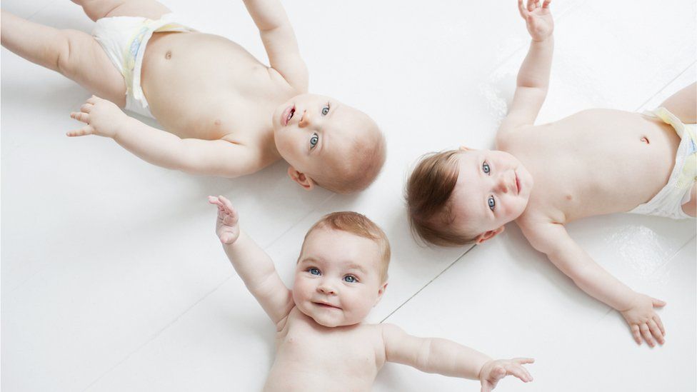 Smiling babies on their backs