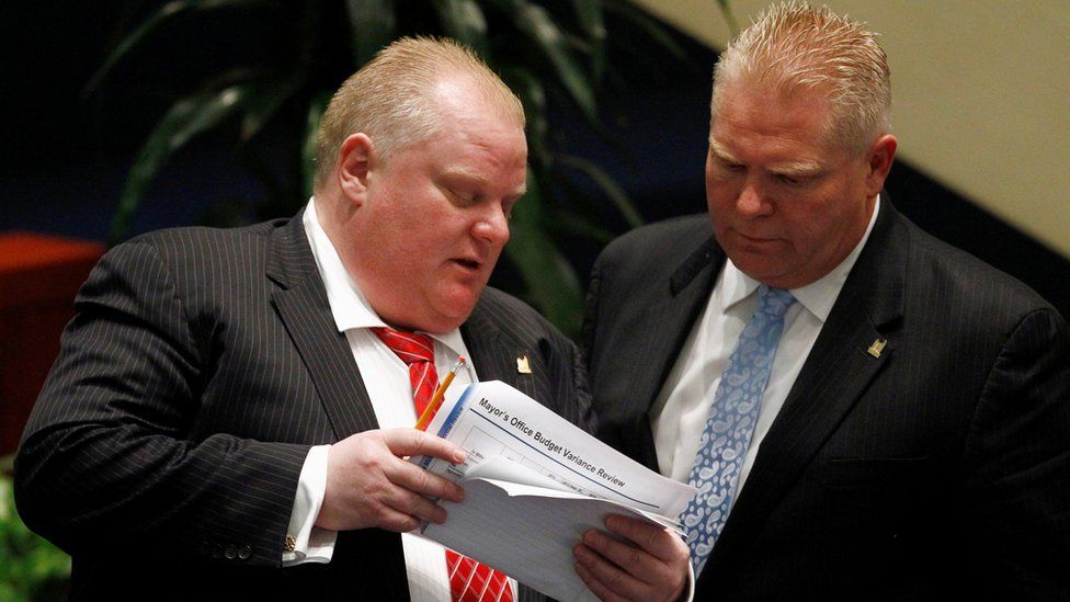 Rob Ford, left, and Doug Ford at City Hall in Toronto, November 2013
