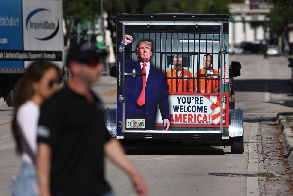 A supporter of former President Donald Trump pulls a trailer around outside the Wilkie D. Ferguson Jr. United States Federal Courthouse where former U.S. President Donald Trump is set to appear in front of a judge on June 13, 2023 in Miami, Florida