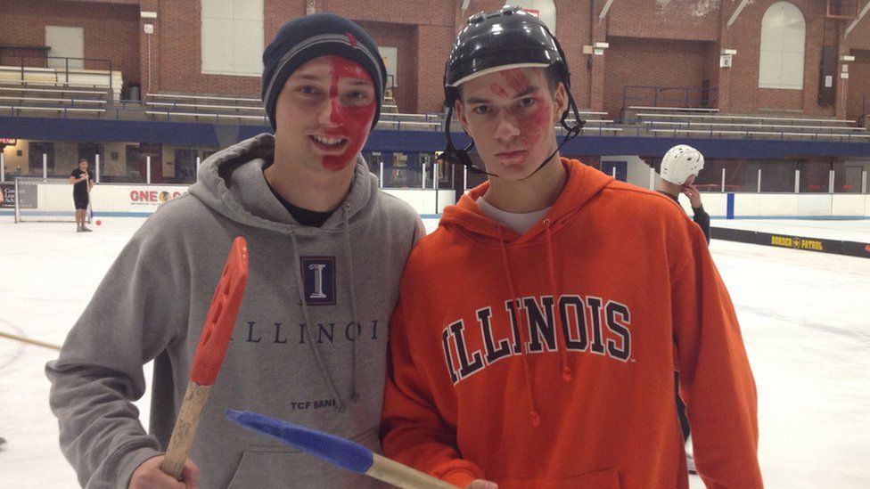 Marcin Kleczynski and a friend at college playing the sport of broomball
