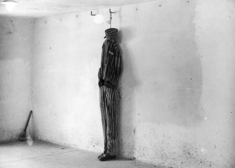 In a photograph taken shortly after the liberation of Buchenwald, a mannequin is used to show how prisoners were hanged in the crematorium cellar