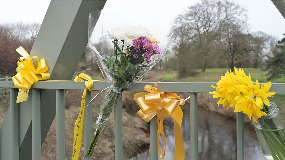 Flowers, and ribbons on a bridge over the River Wyre