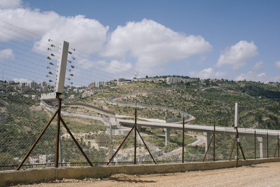 View of the Israeli/Palestinian barrier wall and Route 60 in Har Gillo, West Bank