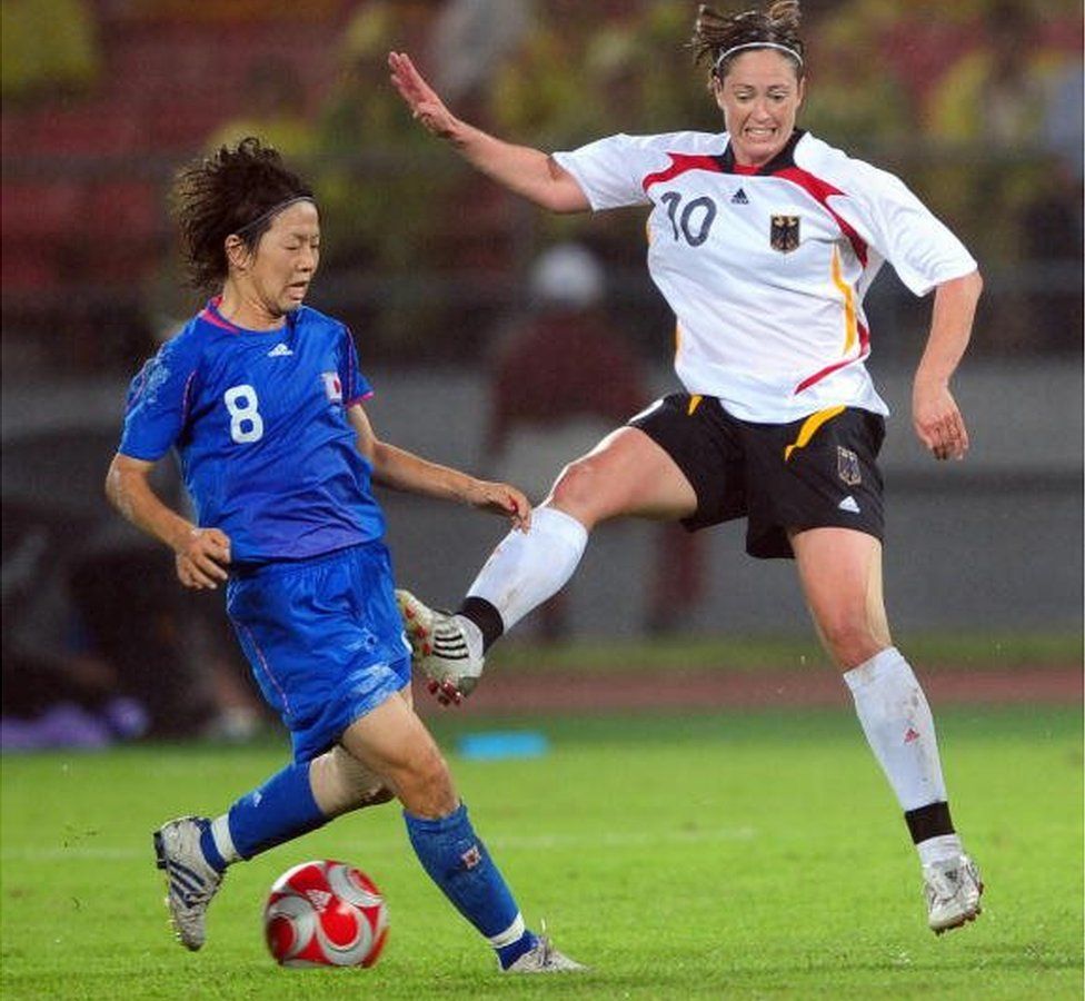 Germany's Renate Lingor (R) vies for the ball with Ava Miyama of Japan during the Bronze medal women's football match of the Beijing 2008 Olympic Games on August 21, 2008, at the Workers Stadium in Beijing.