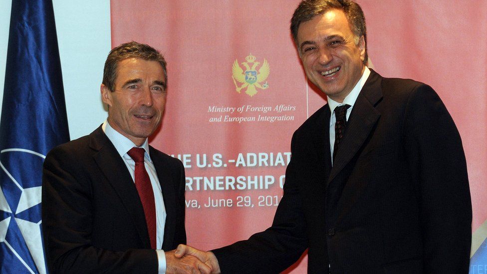 NATO secretary general, Anders Fogh Rasmussen (L) shakes hands with Montenegro's President Filip Vujanovic prior to their meeting in Montenegrin coastal town Becici on June 29, 2011