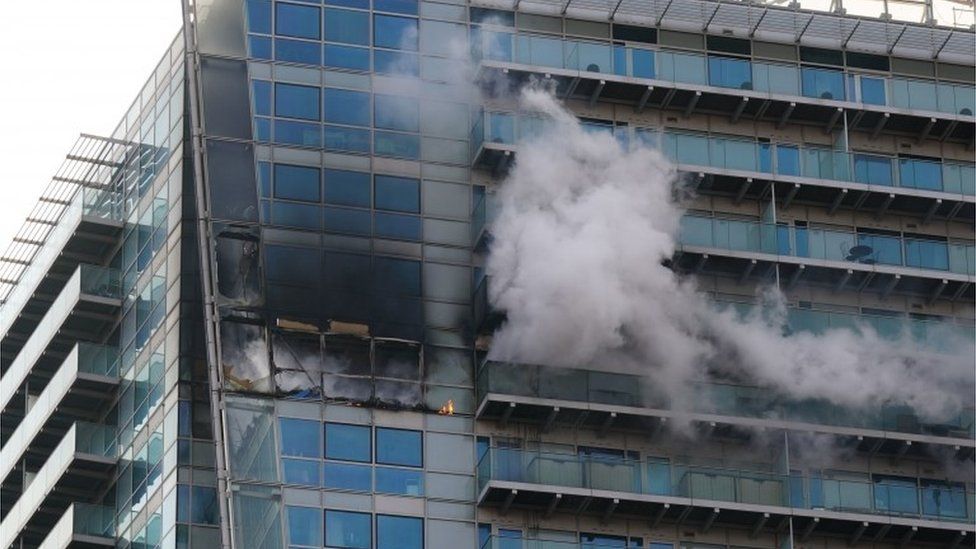 Smoke billows out of a tower block in Whitechapel