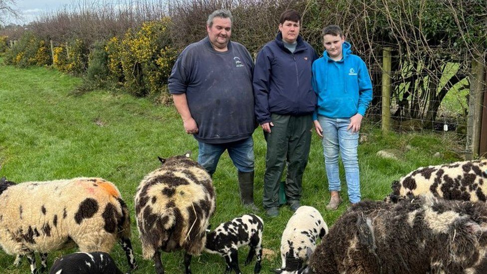 Farmer, Robin McMurtry, with his family on their sheep farm