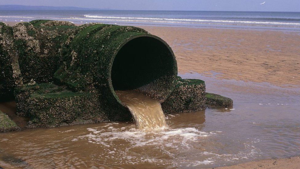 An outlet pipe discharges sewage onto a North Sea beach in Hartlepool