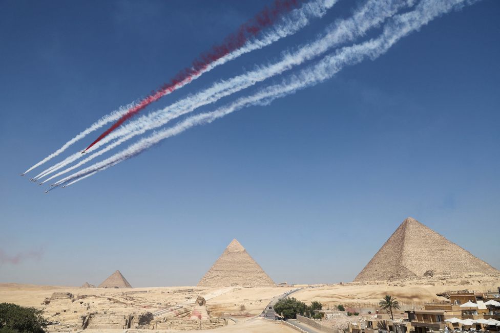 Egyptian Air forces' "Silver Stars" aerobatics perform along with the South Korean "Black Eagles" aerobatic team during Pyramids Air Show 2022 at the Pyramids plateau in Giza, Egypt, August 3, 2022.