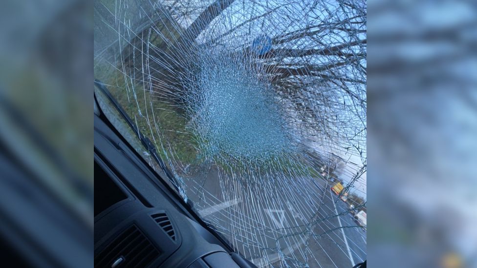 Brick thrown from A12 bridge hits van of father and son BBC News