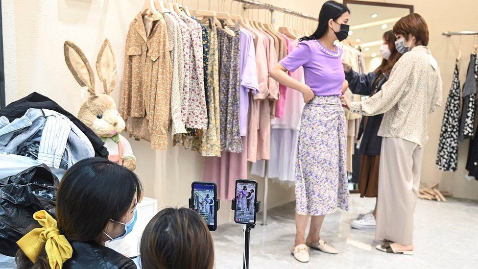 A clothing store in the southern city of Guangzhou sells clothing via live broadcast