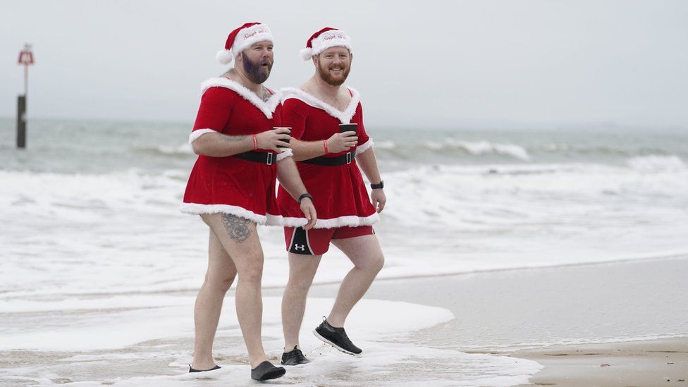 Two men dressed successful  Santa outfits successful  Bournemouth, Dorset