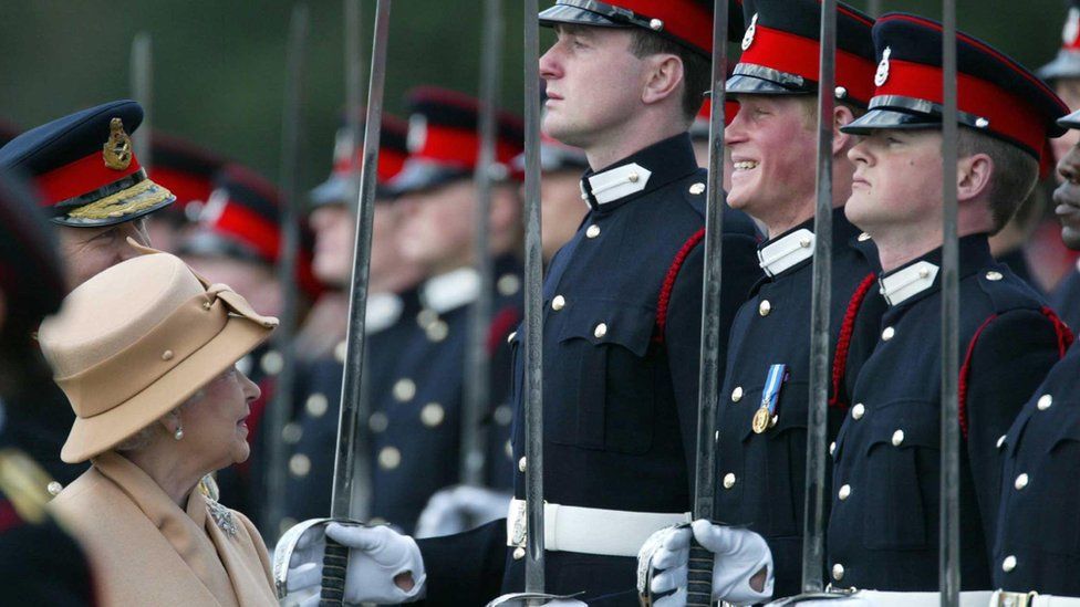 Queen Elizabeth smiles with Prince Harry during the Sovereign's Parade at the Royal Military Academy in Sandhurst in 2006