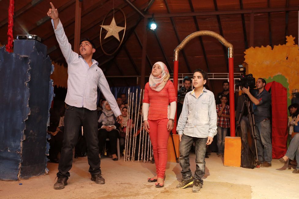 Syrian refugees perform in William Shakespeare's 'Romeo and Juliet', directed by acclaimed Syrian actor Nawar Bulbul, on March 27, 2015 on the rooftop of a makeshift hospital in the Jordanian capital, Amman.