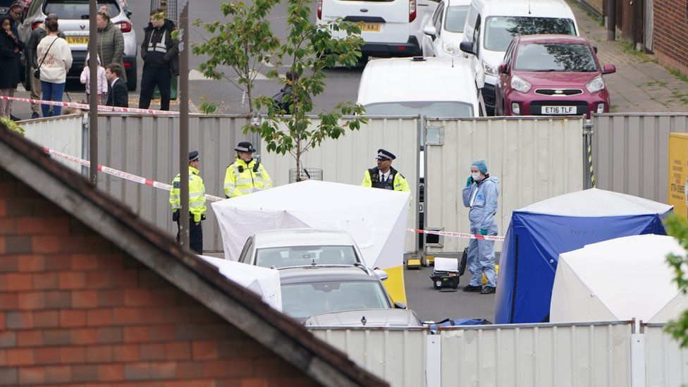 Forensic officers at the scene of the stabbings