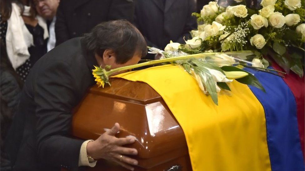 Relatives and friends mourn during the funeral of Ecuadorean El Comercio journalist Javier Ortega, photographer Paul Rivas and driver Efrain Segarra, at La Dolorosa church in Quito on June 29, 2018