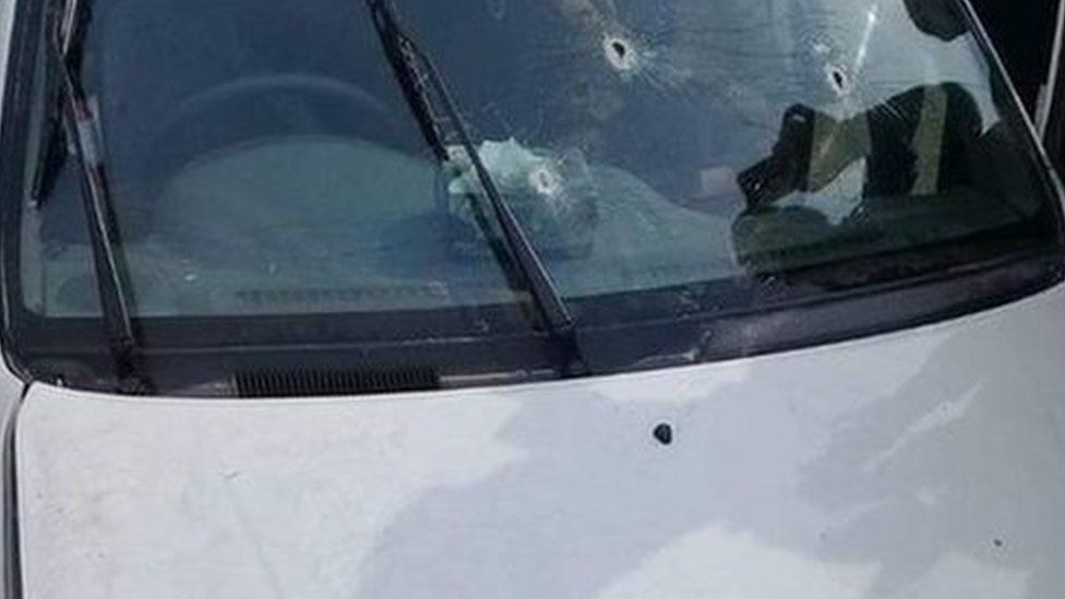 Bullet holes in a car window